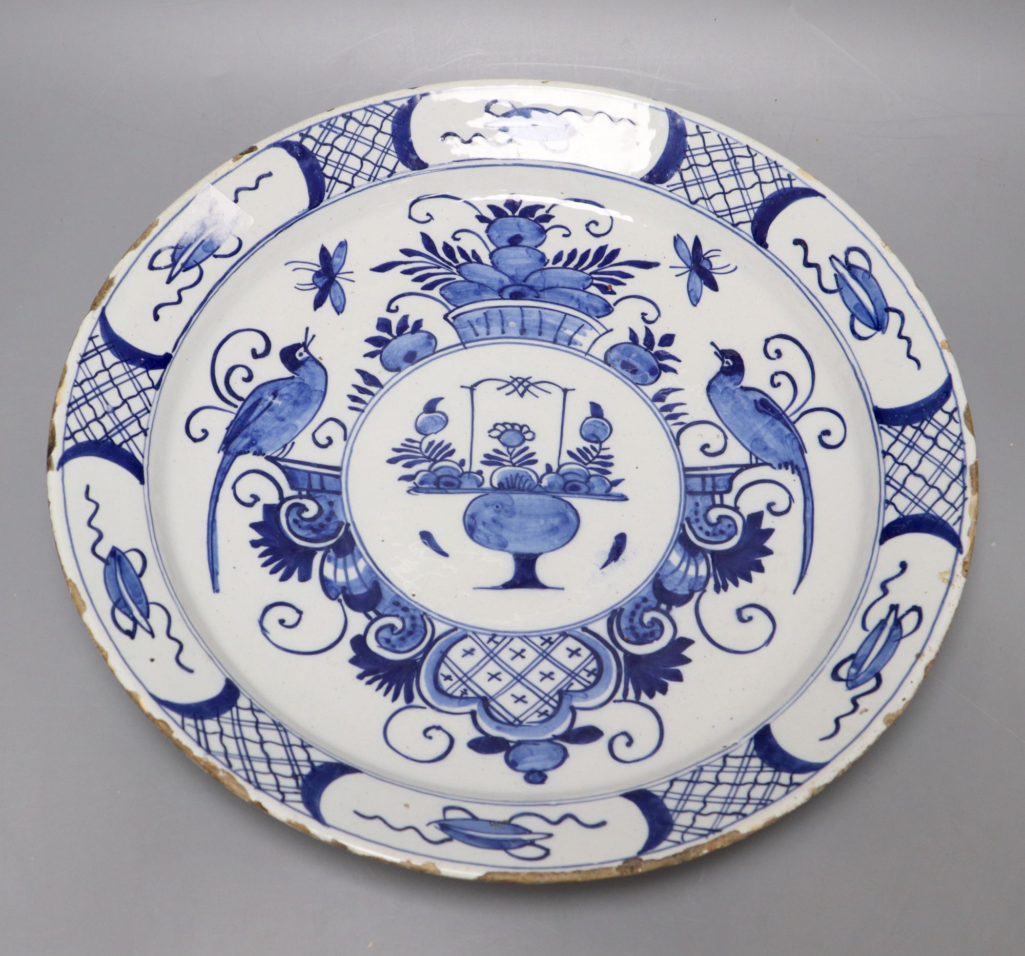 An 18th century blue and white Delft charger, 35cm